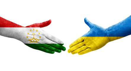 Handshake between Tajikistan and Ukraine flags painted on hands, isolated transparent image.