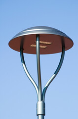 Led street lamp against blue sky.