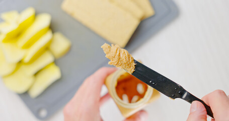 Peanut butter spread on toast bread closeup