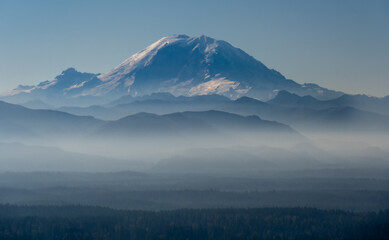 Mount Rainier with layers of forested foothills