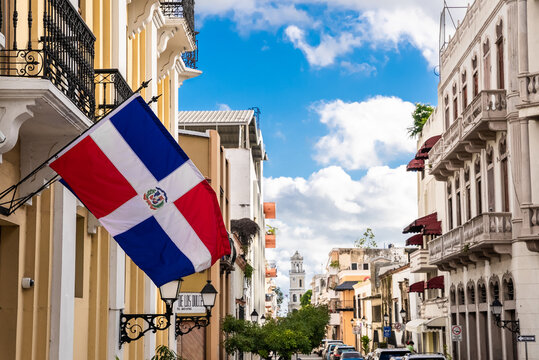Flag of the Dominican Republic on the wall of a building in the colonial zone. Arzobispo Merino street. Popular tourist excursion in Santo Domingo. 