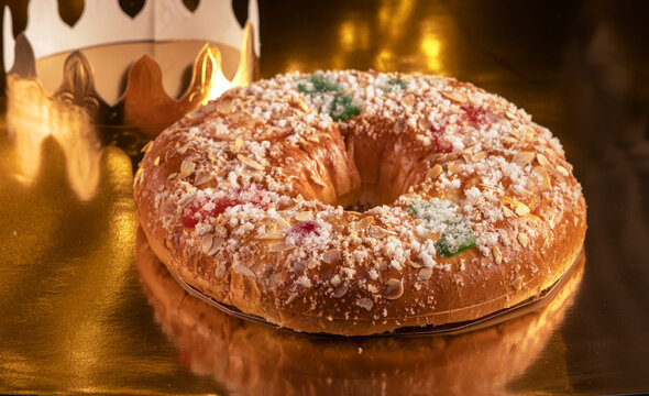 typical spanish roscon de reyes (Epiphany cake) with christmas decorations
