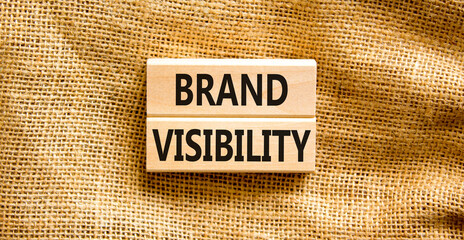Brand visibility symbol. Concept words Brand visibility on wooden blocks. Beautiful canvas table...