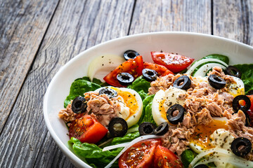 Nicoise salad - tuna, hard boiled eggs, greens, tomatoes and black olives