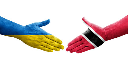 Handshake between Trinidad Tobago and Ukraine flags painted on hands, isolated transparent image.