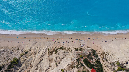 Aerial drone photo of famous paradise beach of Egremni white steep rocky hills overlooking deep turquoise Ionian sea, Lefkada island