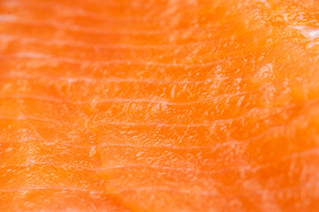 Fresh red salmon fillet cross section texture or background
