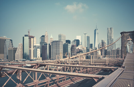 Retro toned picture of New York cityscape seen from the Brooklyn Bridge, USA.