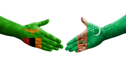 Foto op Aluminium Handshake between Turkmenistan and Zambia flags painted on hands, isolated transparent image. © prehistorik