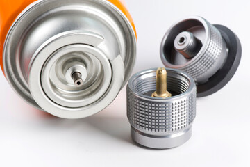 Tourist gas cylinder and fittings on white background.