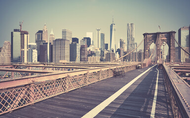 Obraz na płótnie Canvas Retro toned picture of New York cityscape seen from the Brooklyn Bridge, USA.