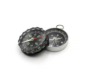 Compass with a black dial isolate on a white background. Traditional navigation device indicating the cardinal points.