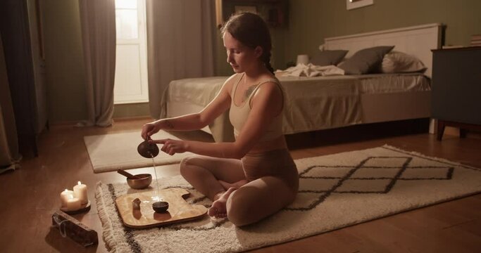 Woman drinking tea during yoga session