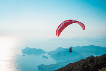 Paraglider flying on Oludeniz beach in Fethiye, Mugla. Travel destination. Summer and holiday...
