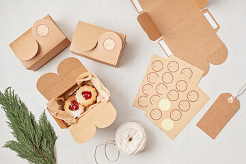 Traditional Linzer or sandwich cookies filled with raspberry jam packed in gift boxes. Xmas handmade gift packages, small business, home baking idea