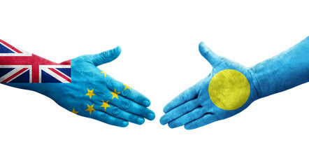 Handshake between Tuvalu and Palau flags painted on hands, isolated transparent image.