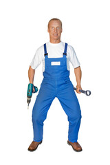 Craftsman series: funny workman imitates cowboy posing with drill.