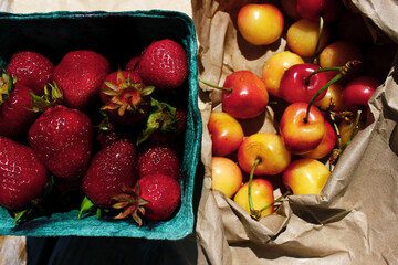 Fresh strawberries and cherries at the farmer's market Fresh fruit