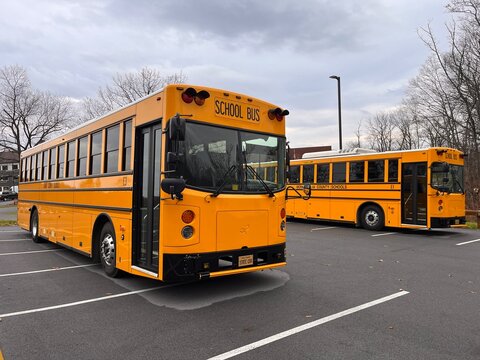 Berkeley Springs, WV, USA - 11 12 2022: Wide angle front and side of new electric school bus part of pilot program in West Virginia, WV.