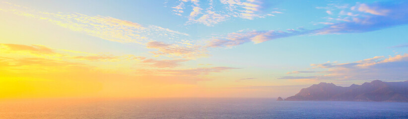sunrise over the sea and the mountains