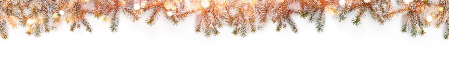 Merry Christmas garland made of snow fir branches on white background with bokeh, sparkles. Happy...