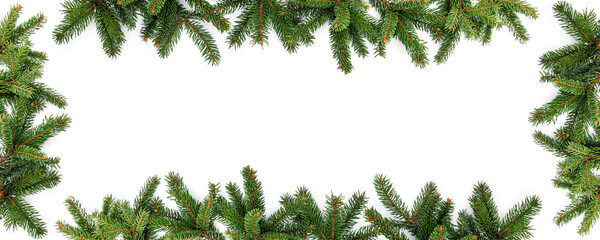 Merry Christmas frame made of green fir branches on white background. Happy New Year and Xmas, top view, wide banner
