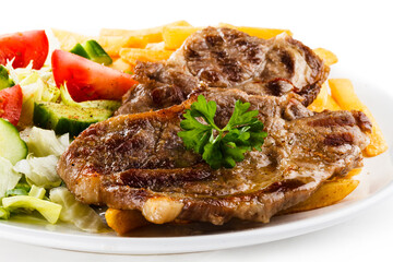 Grilled steak, French fries and vegetables