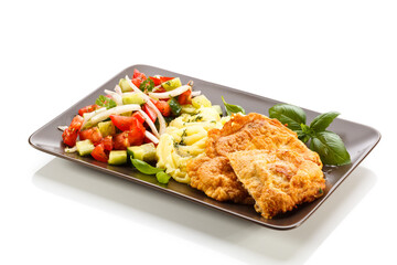 Pork chops, mashed potatoes and vegetable salad