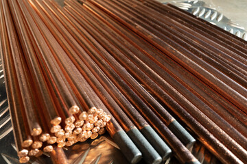Copper coated graphite electrodes