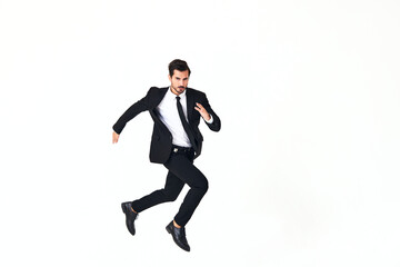 Fototapeta na wymiar Man business smile with teeth in costume running and jumping up full-length on white isolated background copy space 