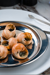 Oven baked snails with pesto sauce