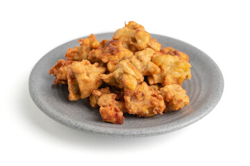 banana fritter or fried banana on a plate isolated on white background