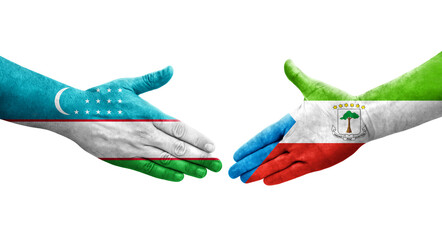 Handshake between Uzbekistan and Equatorial Guinea flags painted on hands, isolated transparent image.