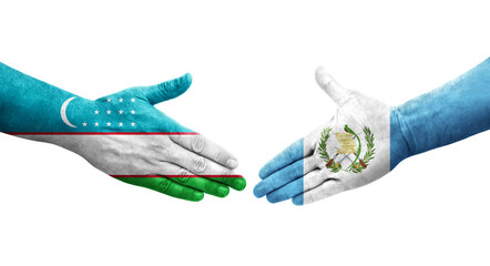 Handshake between Uzbekistan and Guatemala flags painted on hands, isolated transparent image.