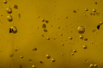 Background of thick and yellow substance with bubbles