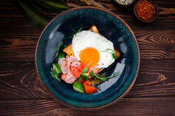 Toast with fried egg, bacon Delicious breakfast