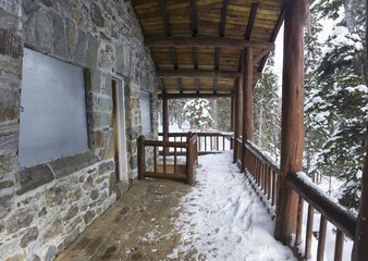Snow Covered Alpine Teahouse Log Cabin Porch closed for Season. Plain of Six Glaciers Hiking above Lake Louise in Banff National Park Canadian Rockies