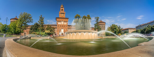 Naklejka premium Panoramic view of Castello Sforzesco square with fountain in Milan, Italy. Long Exposure.