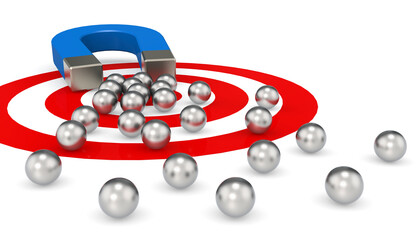 Magnet attracts red metal balls isolated