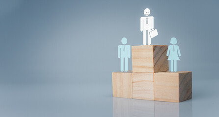 Concept of Business and HR for leadership and team leader. one people icon stand top wood. Different and stand out from the group