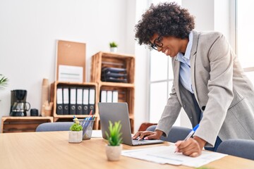 African american woman business worker using laptop working at office