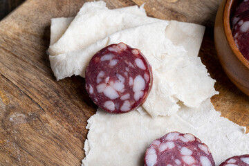 Sliced pork sausage with bacon