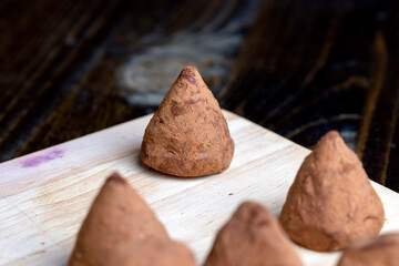Chocolate truffle candy on the board