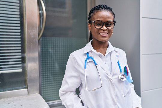 African american woman doctor smiling confident standing at hospital