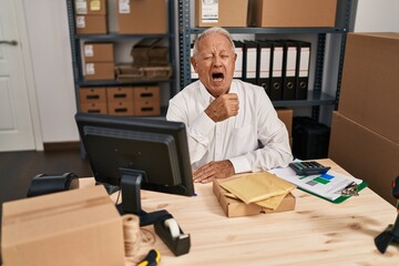 Senior man ecommerce business worker tired working at office