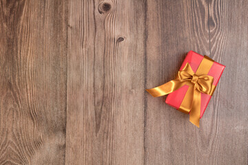 Gift box on wooden table