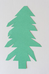 abstract cut paper tree on blank paper