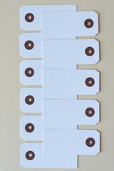 overlapping white paper tags