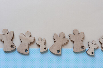 wooden angels on paper