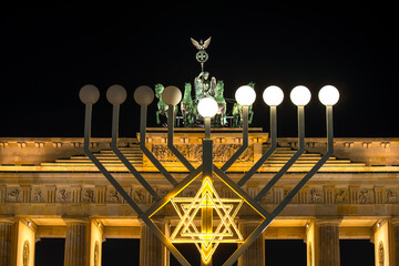 Brandenburg gate and and hanukkah menorah in Berlin, Germany - obrazy, fototapety, plakaty